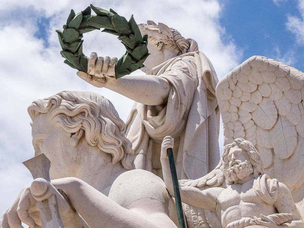 Portugal-Lisbon-Close-up of sculptures at the top of 18th century Arco da Rua Augusta-Statue of Glo